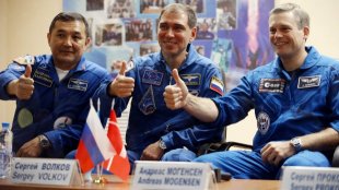From left: Kazakhstan's cosmonaut Aydyn Aimbetov, Russian cosmonaut Sergei Volkov and Denmark's astronaut Andreas ...