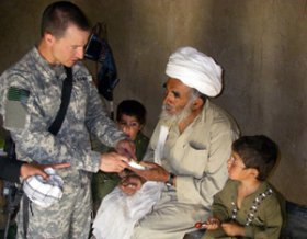 Maj. Andrew Morgan conducts a medical clinic for Afghan nationals in Helmand province, Afghanistan in April 2009. He was recently selected to be a member of NASA's 2013 astronaut candidate class - on of two Soldiers who made the cut. (Photo courtesy of Maj. Andrew Morgan)