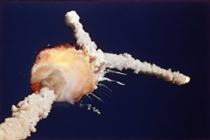 The Space Shuttle Challenger explodes shortly after lifting off from Kennedy Space Center, Fla., Tuesday, Jan. 28, 1986. All seven crew members died in the explosion, which was blamed on faulty O-rings in the shuttle's booster rockets. The Challenger's crew was honored with burials at Arlington National Cemetery.