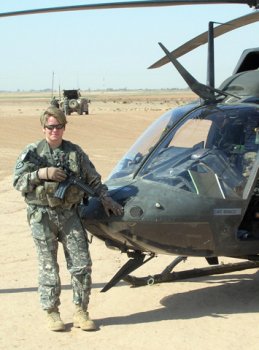 Then-Capt. Anne McClain poses with her OH-58D Kiowa Warrior helicopter in Kirkuk, Iraq, May 2007. McClain, now a major, is one of two Soldiers selected for NASA's 2013 astronaut candidate class. (Photo courtesy of Maj. Anne McClain)
