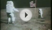 Apollo 16 astronaut saluting the flag.