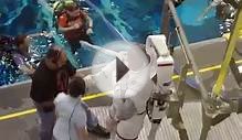 Astronaut being removed from suit after dive