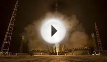 Astronauts board space station for 1-year mission